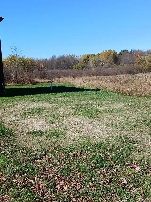 Open field property in Dewittville, New York prepared for septic excavation